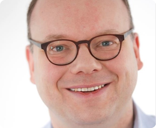 Portrait of man with glasses smiling