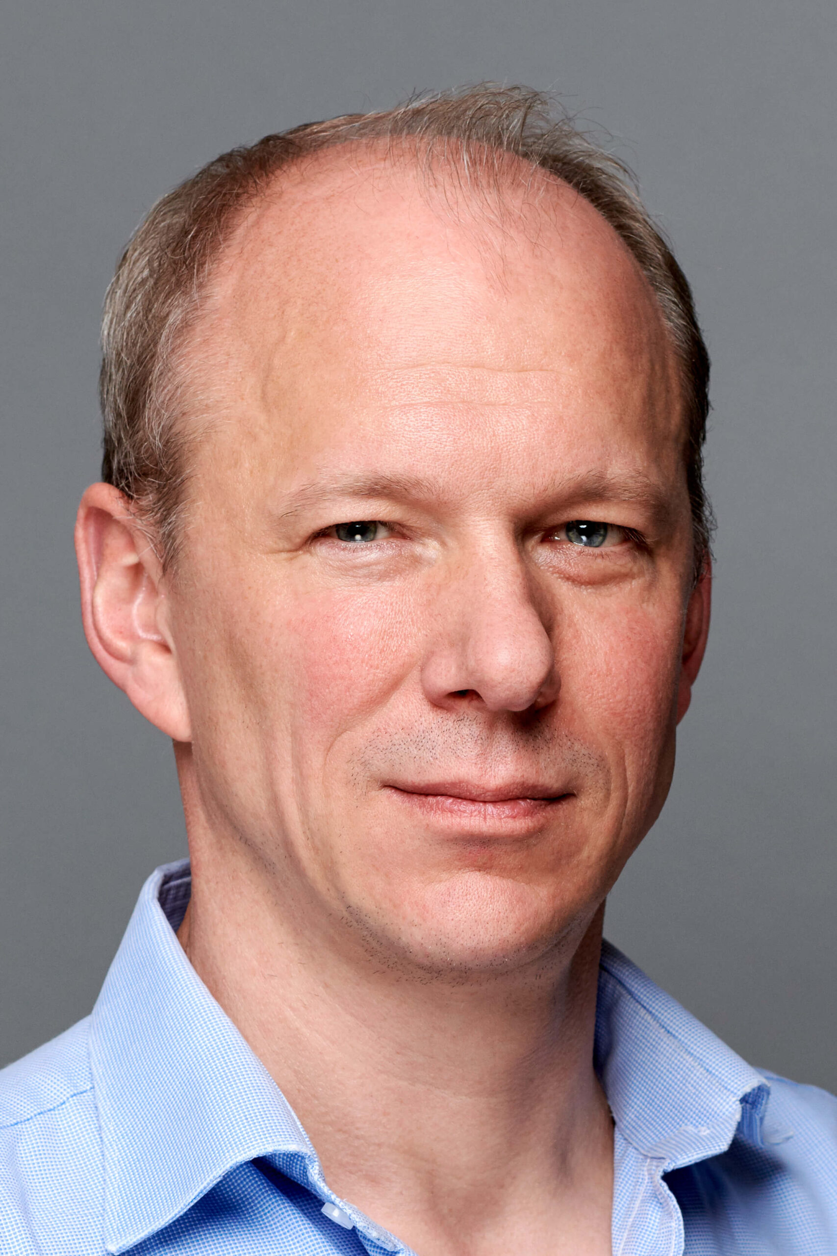 Portrait of man in blue shirt